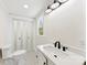 Clean bathroom with a modern vanity, and a classic black and white tile floor at 103 Park Ave, Mount Holly, NC 28120