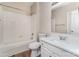 Well-lit bathroom features a shower-tub, white vanity with countertop, and modern fixtures at 10325 Merlin Meadows Ct, Charlotte, NC 28277
