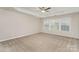 Spacious bedroom with carpet, ceiling fan and natural light at 10325 Merlin Meadows Ct, Charlotte, NC 28277
