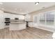 Bright eat-in kitchen with an island and a door that leads to the backyard at 10325 Merlin Meadows Ct, Charlotte, NC 28277