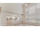 Open-concept living room with lots of natural light, leading to the kitchen at 10325 Merlin Meadows Ct, Charlotte, NC 28277