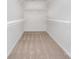 A walk-in closet with carpet and multiple shelving units at 10325 Merlin Meadows Ct, Charlotte, NC 28277