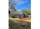 View of back of home featuring a deck and spacious yard at 104 Edgewater Nw Dr, Concord, NC 28027
