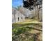 View of expansive backyard with lush greenery, mature trees, and natural surroundings at 104 Edgewater Nw Dr, Concord, NC 28027