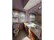 Well-lit bathroom featuring double sinks and an abundance of natural light at 104 Edgewater Nw Dr, Concord, NC 28027