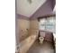 Traditional bathroom featuring a soaking tub, toilet and built in storage at 104 Edgewater Nw Dr, Concord, NC 28027