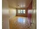Well-lit bedroom featuring a wood floor and three windows at 104 Edgewater Nw Dr, Concord, NC 28027