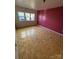 Bright bedroom featuring a wood floor and three windows at 104 Edgewater Nw Dr, Concord, NC 28027