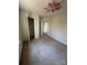 Bedroom featuring carpeted floors, neutral walls, an open closet, and a ceiling fan at 104 Edgewater Nw Dr, Concord, NC 28027