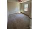 This cozy bedroom features natural light from the window and a ceiling fan for added comfort at 104 Edgewater Nw Dr, Concord, NC 28027