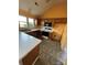 Efficient kitchen with oak cabinetry, tile floors, and appliances at 104 Edgewater Nw Dr, Concord, NC 28027
