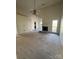Large living room with a fireplace and natural light with entry to the kitchen and dining area at 104 Edgewater Nw Dr, Concord, NC 28027