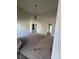 Living room featuring vaulted ceilings, ceiling fan, fireplace, and access to other areas of the home at 104 Edgewater Nw Dr, Concord, NC 28027