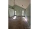 Spacious bedroom with vaulted ceiling and ample natural light from the windows at 104 Edgewater Nw Dr, Concord, NC 28027