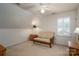 Finished attic space with a futon, natural light and carpeting at 107 Southfork Dr, Belmont, NC 28012