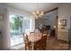 Cozy dining area with access to the outside porch and view to the living room at 107 Southfork Dr, Belmont, NC 28012