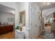Traditional hallway with hardwood floors, a staircase, and views into the dining and living rooms at 107 Southfork Dr, Belmont, NC 28012