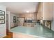 The kitchen features ample counter space with appliances and wooden cabinets with view to dining area at 107 Southfork Dr, Belmont, NC 28012