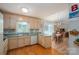 Kitchen with ample counter space, view to the dining area and appliances at 107 Southfork Dr, Belmont, NC 28012