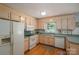 Spacious kitchen with appliances, wood cabinets, and plenty of counter space at 107 Southfork Dr, Belmont, NC 28012