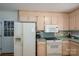 Bright kitchen with appliances, wood cabinets, and access to the outside at 107 Southfork Dr, Belmont, NC 28012