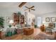 Spacious living room with hardwood floors, a ceiling fan, and a well-stocked bookshelf at 107 Southfork Dr, Belmont, NC 28012