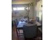 Dining area with a dark wood table and tufted gray chairs at 110 Buffalo Nw Ave, Concord, NC 28025