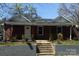 Charming brick single-story home with a well-maintained front yard and inviting entryway at 110 Buffalo Nw Ave, Concord, NC 28025