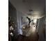 Hallway featuring a sofa, mirror decor, and hardwood floors at 110 Buffalo Nw Ave, Concord, NC 28025
