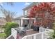 Backyard features a deck for outdoor dining, screened in porch, and a beautiful red Japanese Maple tree at 11204 Arlen Park Dr, Huntersville, NC 28078