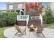 Backyard patio with a fire pit and Adirondack chairs creates a cozy outdoor living space at 11204 Arlen Park Dr, Huntersville, NC 28078