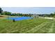 Inviting basketball court with a smooth blue surface and well-maintained surroundings for active recreation at 11204 Arlen Park Dr, Huntersville, NC 28078