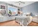 Comfortable bedroom features a window seat, built-in shelving and ample natural light at 11204 Arlen Park Dr, Huntersville, NC 28078