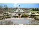 Stately clubhouse featuring manicured landscaping, elegant architecture, and convenient parking at 11204 Arlen Park Dr, Huntersville, NC 28078