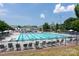 Resort-style community pool featuring lap lanes, lounge chairs, and a playful splash zone at 11204 Arlen Park Dr, Huntersville, NC 28078