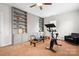 Exercise room featuring built-in shelves, a Peloton bike and a pilates machine at 11204 Arlen Park Dr, Huntersville, NC 28078