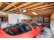 Large garage provides ample parking and storage space with a red sports car at 11204 Arlen Park Dr, Huntersville, NC 28078