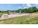 Well-equipped playground with multiple slides, swings, and climbing structures for enjoyment at 11204 Arlen Park Dr, Huntersville, NC 28078
