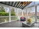 Relaxing screened porch with comfortable seating and ceiling fan, perfect for enjoying the outdoors at 11204 Arlen Park Dr, Huntersville, NC 28078