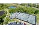 Aerial view of tennis courts surrounded by lush greenery, offering a private and serene playing environment at 11204 Arlen Park Dr, Huntersville, NC 28078