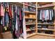 Large walk-in closet with custom wood shelving and ample storage for clothes and accessories at 11204 Arlen Park Dr, Huntersville, NC 28078