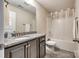 Bathroom featuring a granite vanity, neutral paint, grey tile flooring and a shower over tub at 1129 Black Walnut Rd, Clover, SC 29710