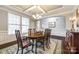 Spacious dining room featuring elegant decor, large windows, and beautiful hardwood floors at 1129 Black Walnut Rd, Clover, SC 29710