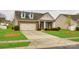 Charming brick home with dormer windows, manicured landscaping, and a spacious driveway at 1129 Black Walnut Rd, Clover, SC 29710