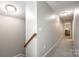 Upstairs hallway features neutral paint and carpet with access to bedrooms at 1129 Black Walnut Rd, Clover, SC 29710
