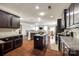 Open kitchen with a large island, modern appliances, and seamless transition to the dining area at 1129 Black Walnut Rd, Clover, SC 29710