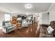 Spacious living room with hardwood floors, comfortable seating, and an open layout to the kitchen at 1129 Black Walnut Rd, Clover, SC 29710