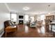 Open-concept living room featuring hardwood floors, a cozy fireplace, and ample natural light at 1129 Black Walnut Rd, Clover, SC 29710
