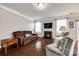 Cozy living room with a fireplace, hardwood floors, comfortable seating, and ample natural light at 1129 Black Walnut Rd, Clover, SC 29710