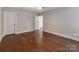 Spacious bedroom featuring hardwood floors, ceiling fan, and neutral wall color at 11939 Fiddlers Roof Ln, Charlotte, NC 28277